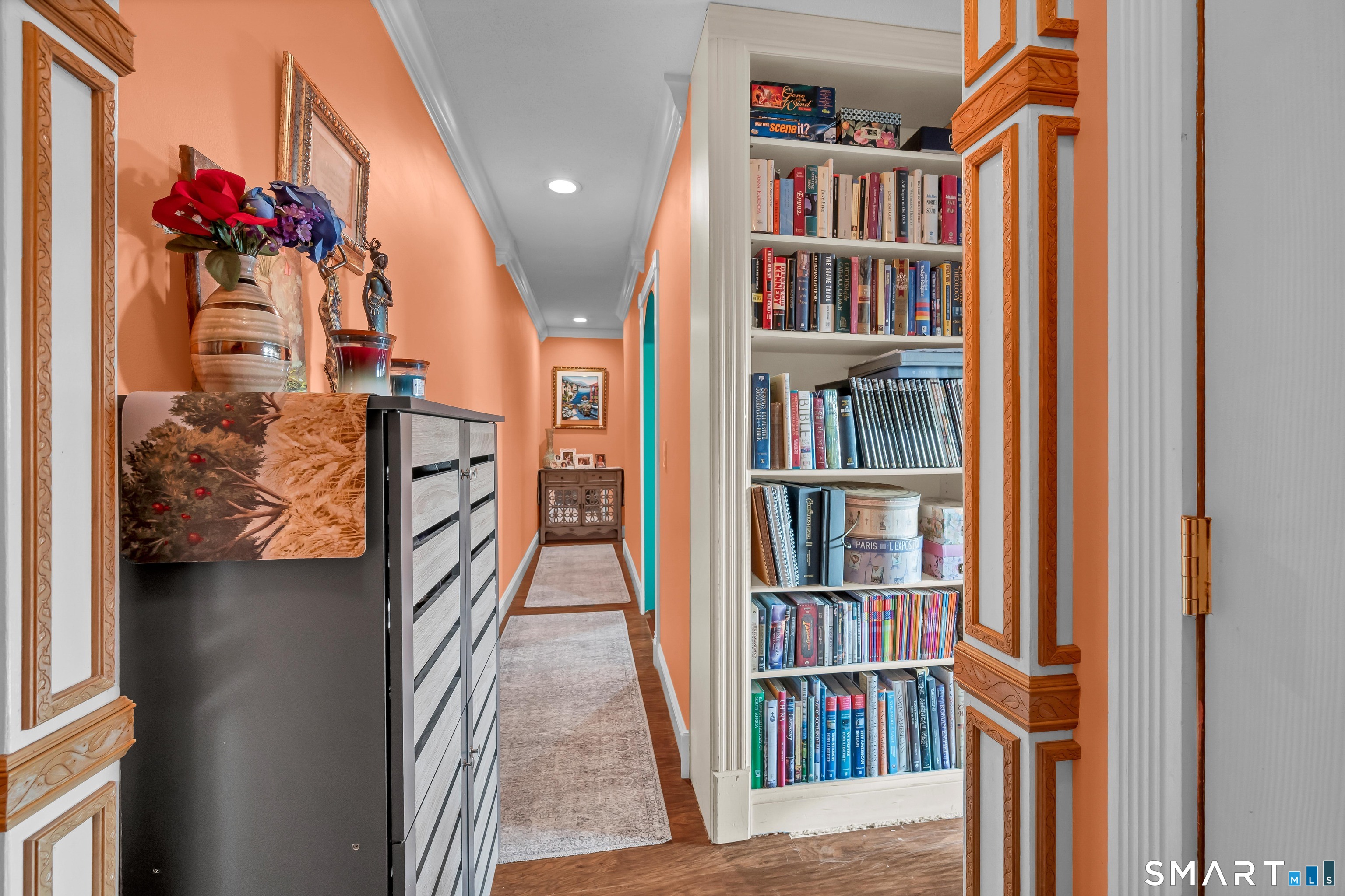 166 Old Brookfield Road, Unit 18A6 Danbury, CT 06811 - Photo 2 of 19 a view of a living room and a book shelf
