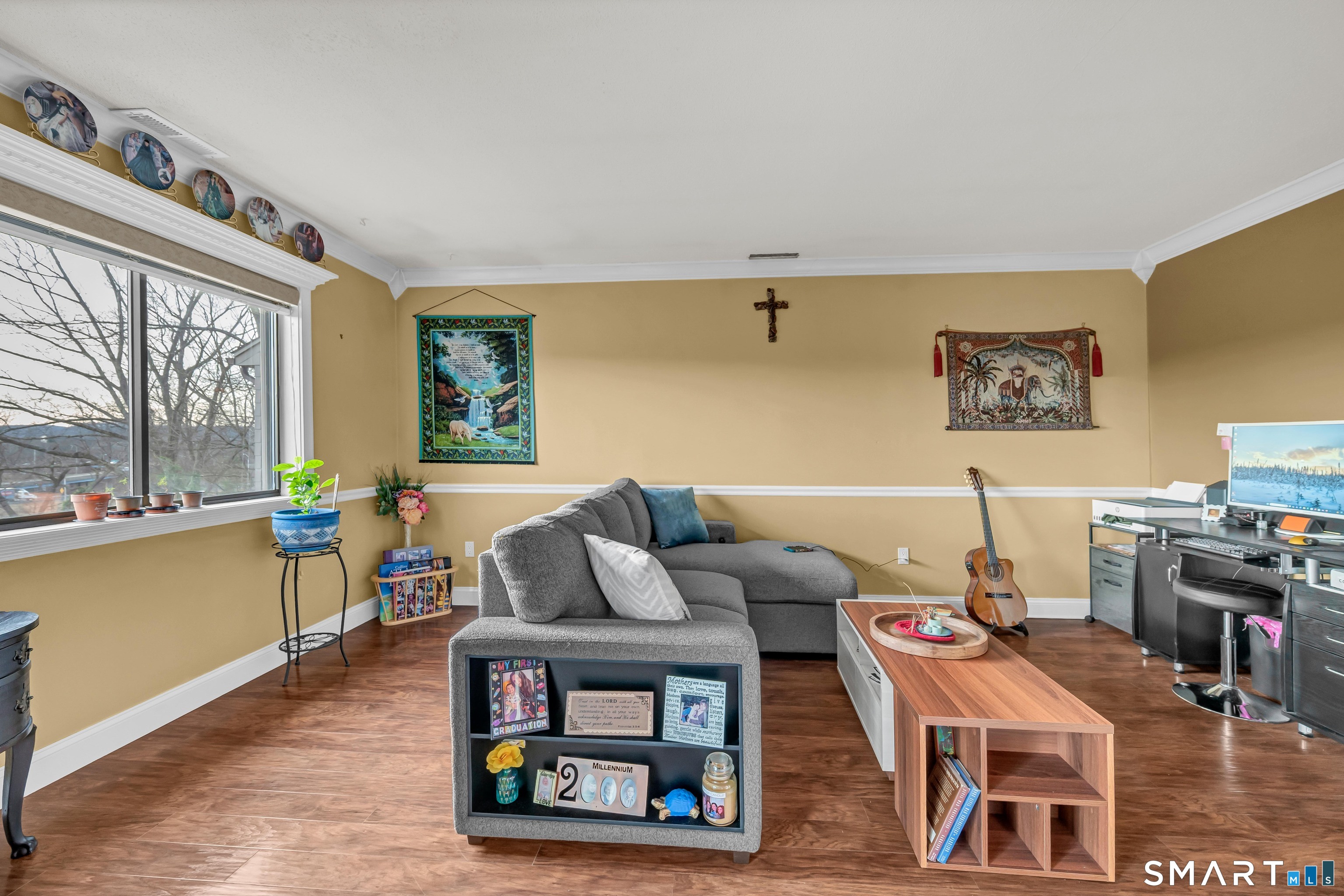 166 Old Brookfield Road, Unit 18A6 Danbury, CT 06811 - Photo 4 of 19 a living room with furniture a wooden floor and a large window