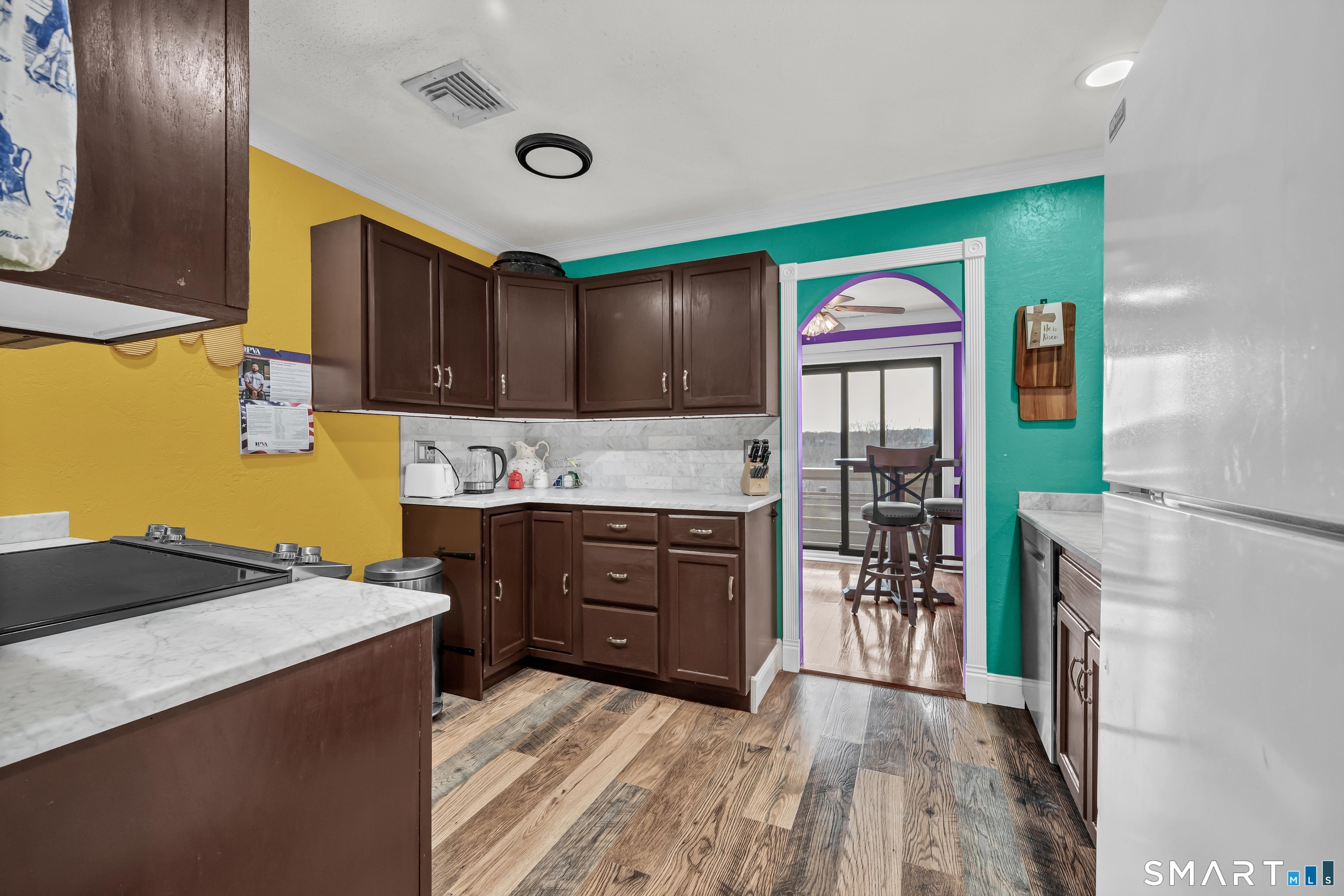166 Old Brookfield Road, Unit 18A6 Danbury, CT 06811 - Photo 9 of 19 a kitchen with stainless steel appliances granite countertop a refrigerator a stove and a wooden floor