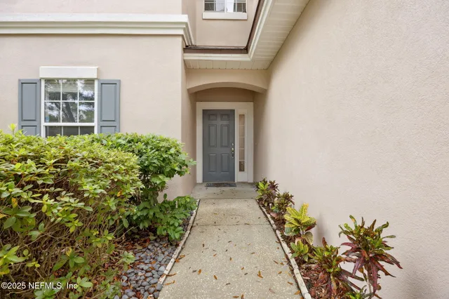 front view of a house with a small yard