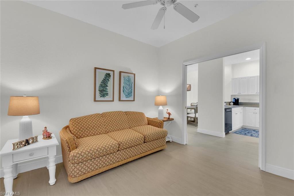 7925 Mahogany Run Lane, Unit 924 Naples, FL 34113 - Photo 15 of 40 a living room with furniture and a walk in closet