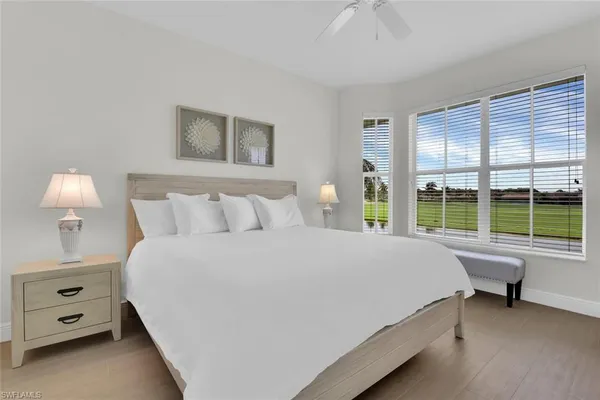 a bedroom with furniture and a flat screen tv