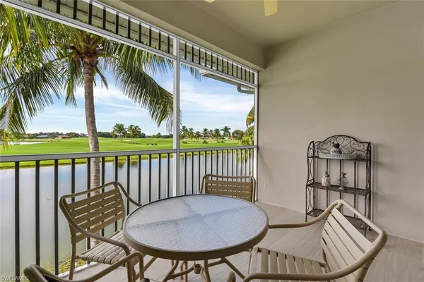a view of a chairs and table in the patio