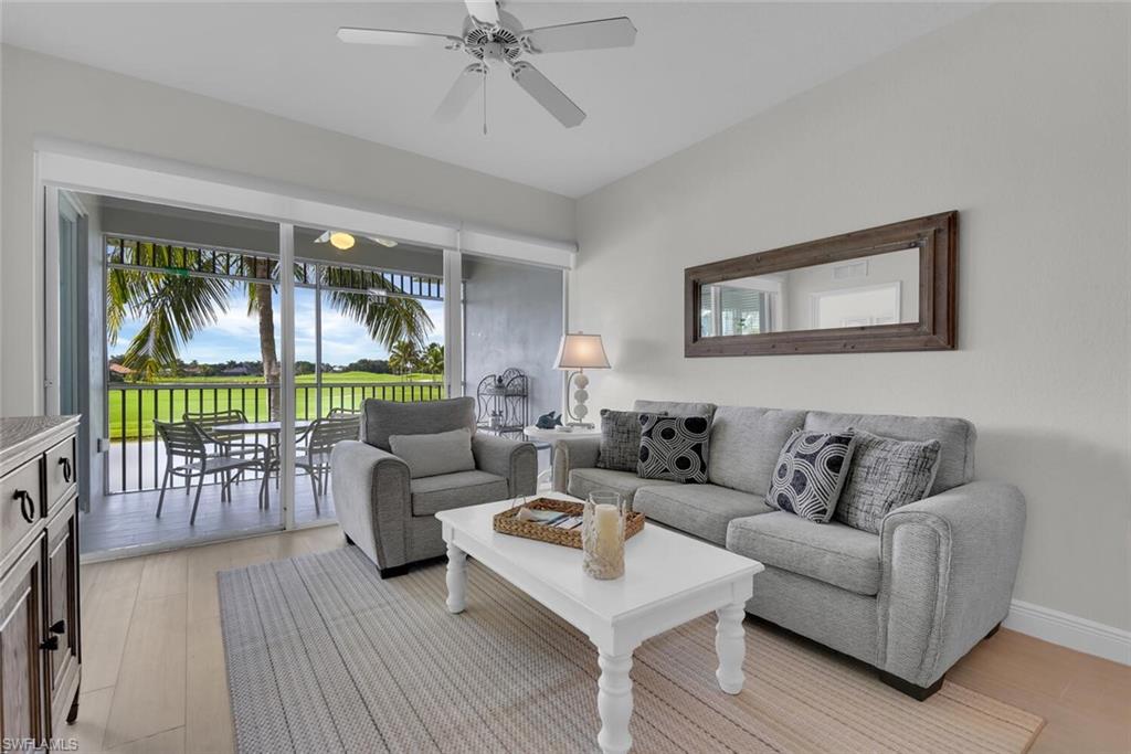 7925 Mahogany Run Lane, Unit 924 Naples, FL 34113 - Photo 4 of 40 a living room with furniture and a large window