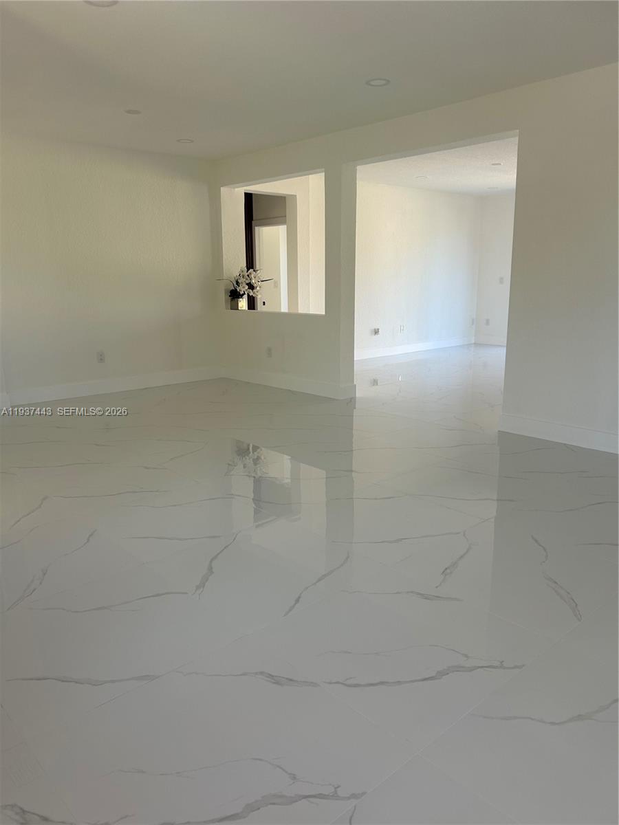 7729 Northwest 194th Terrace Hialeah, FL 33015 - Photo 7 of 21 a bathroom with a shower