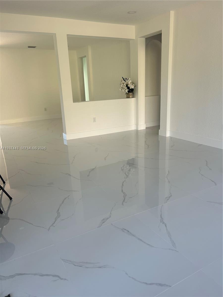 7729 Northwest 194th Terrace Hialeah, FL 33015 - Photo 8 of 21 a bathroom with a bathtub