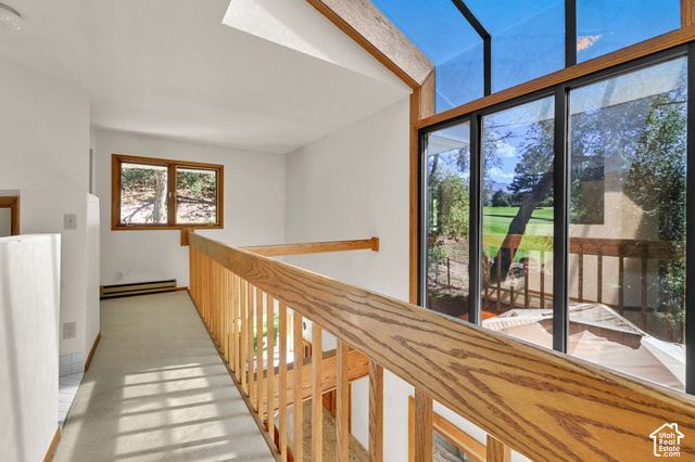 965 Newberry Road Salt Lake City, UT 84108 - Photo 23 of 43 Open-concept upper level with natural oak railing, expansive windows, and skylights