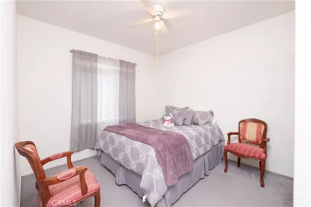 a bedroom with a bed and a table