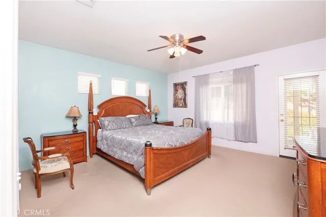 a bed room with a bed and a chair