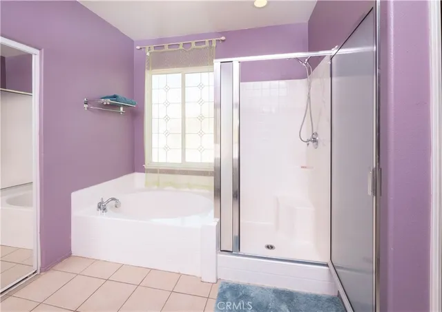 a white bath tub sitting next to a window