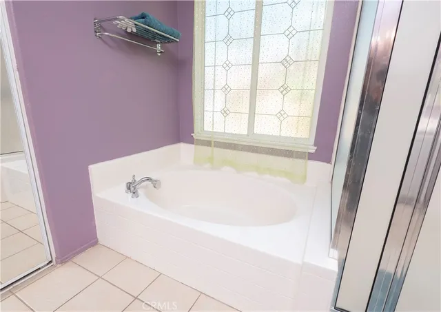 a bathroom with a sink vanity and mirror