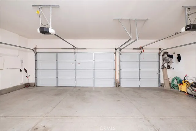 a view of work space with furniture and white walls