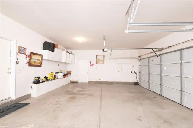 a view of a porch with furniture and a yard
