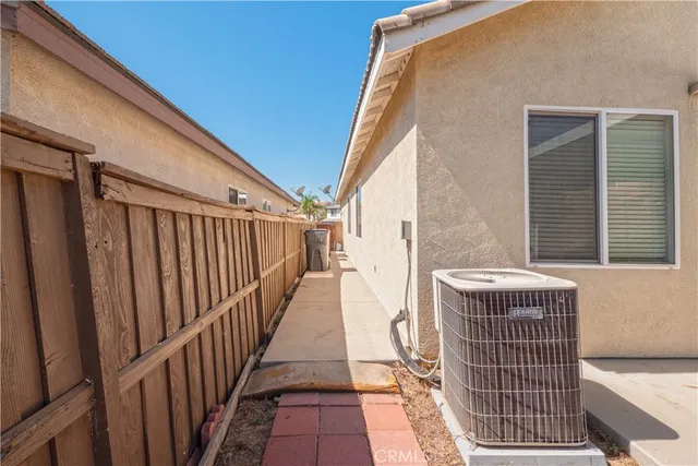 an aerial view of residential house with outdoor space and swimming pool