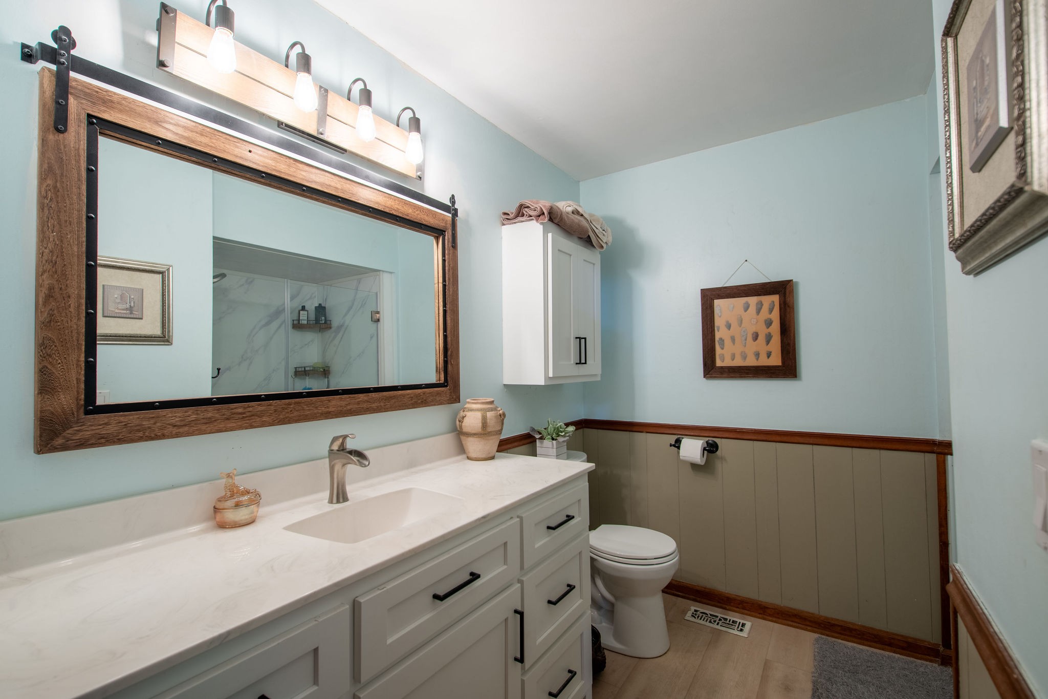 323 Spring Creek Road Lawrenceburg, TN 38464 - Photo 20 of 49 a bathroom with a toilet sink and mirror