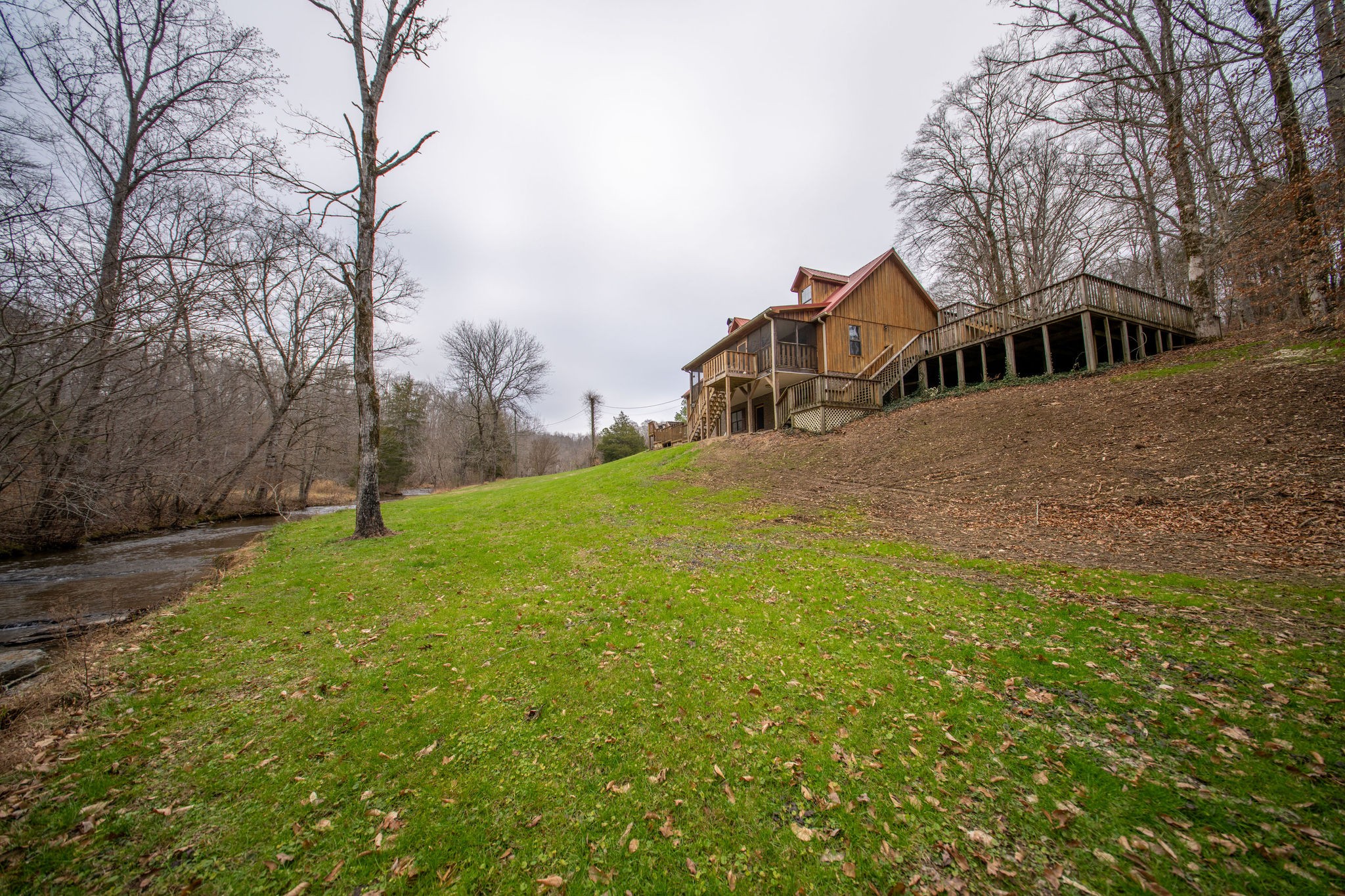 323 Spring Creek Road Lawrenceburg, TN 38464 - Photo 2 of 49 a front view of a house with a yard