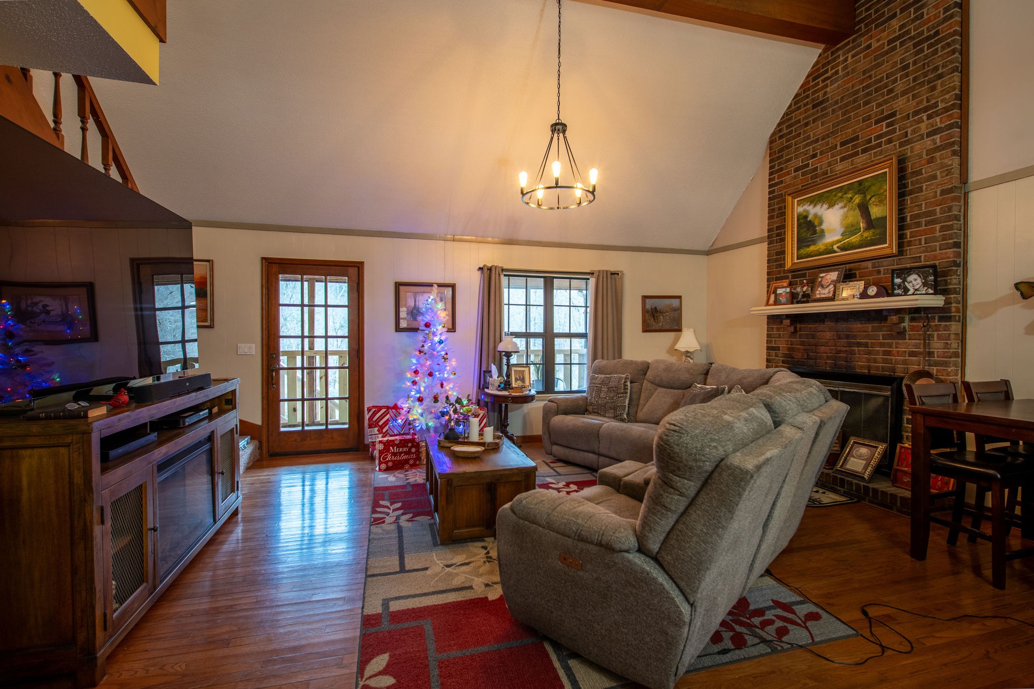 323 Spring Creek Road Lawrenceburg, TN 38464 - Photo 9 of 49 a living room with fireplace furniture and a flat screen tv