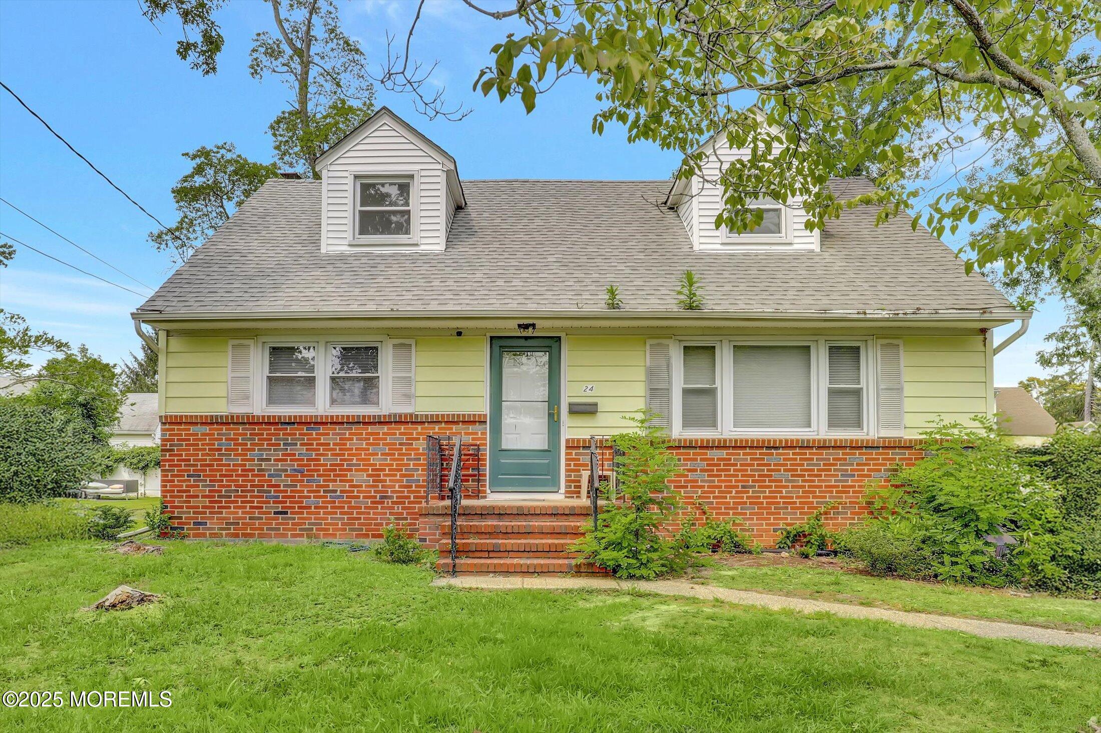a front view of a house with a yard