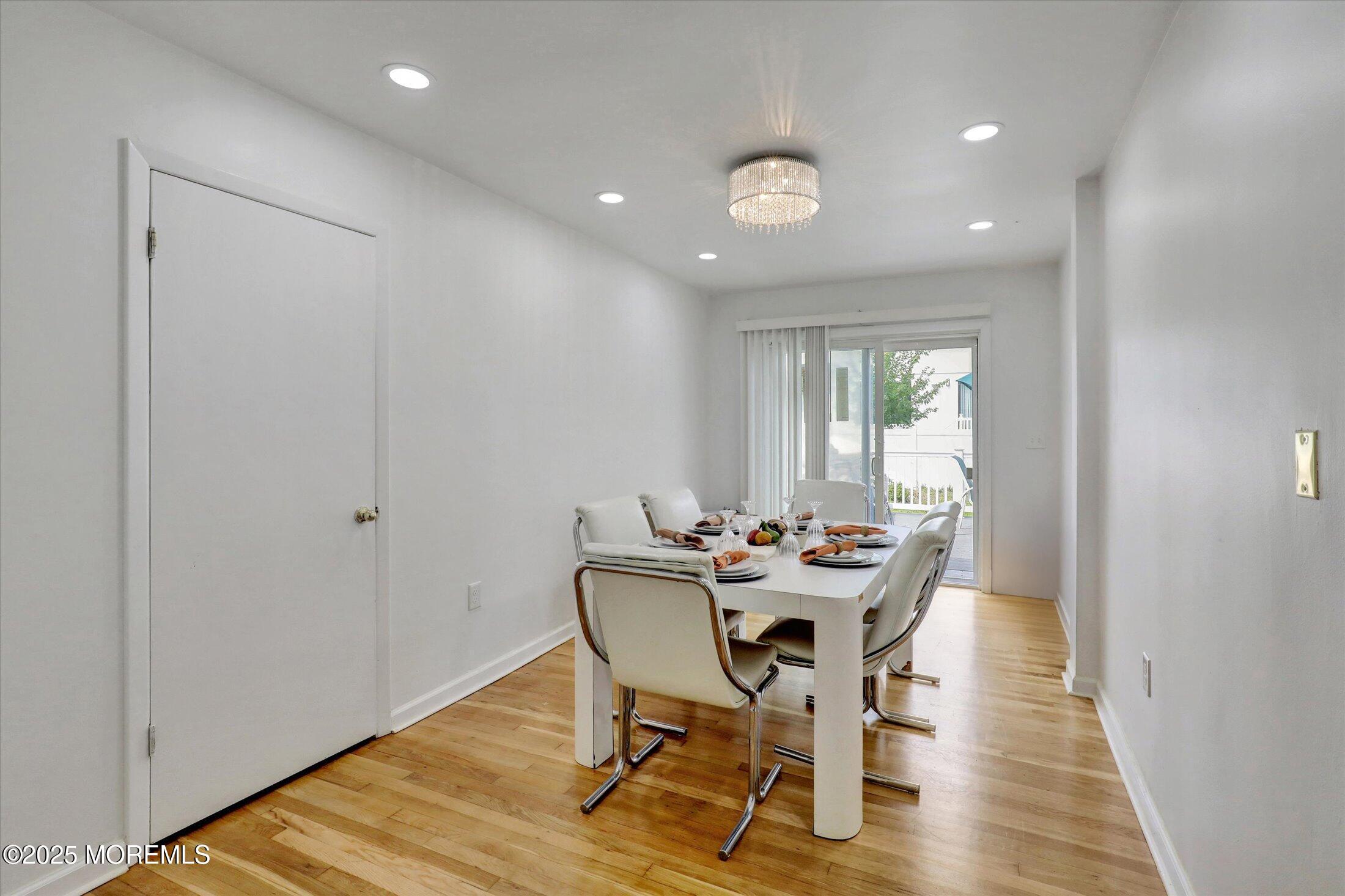 24 Berger Avenue Oakhurst, NJ 07755 - Photo 18 of 49 a dining room with furniture and wooden floor