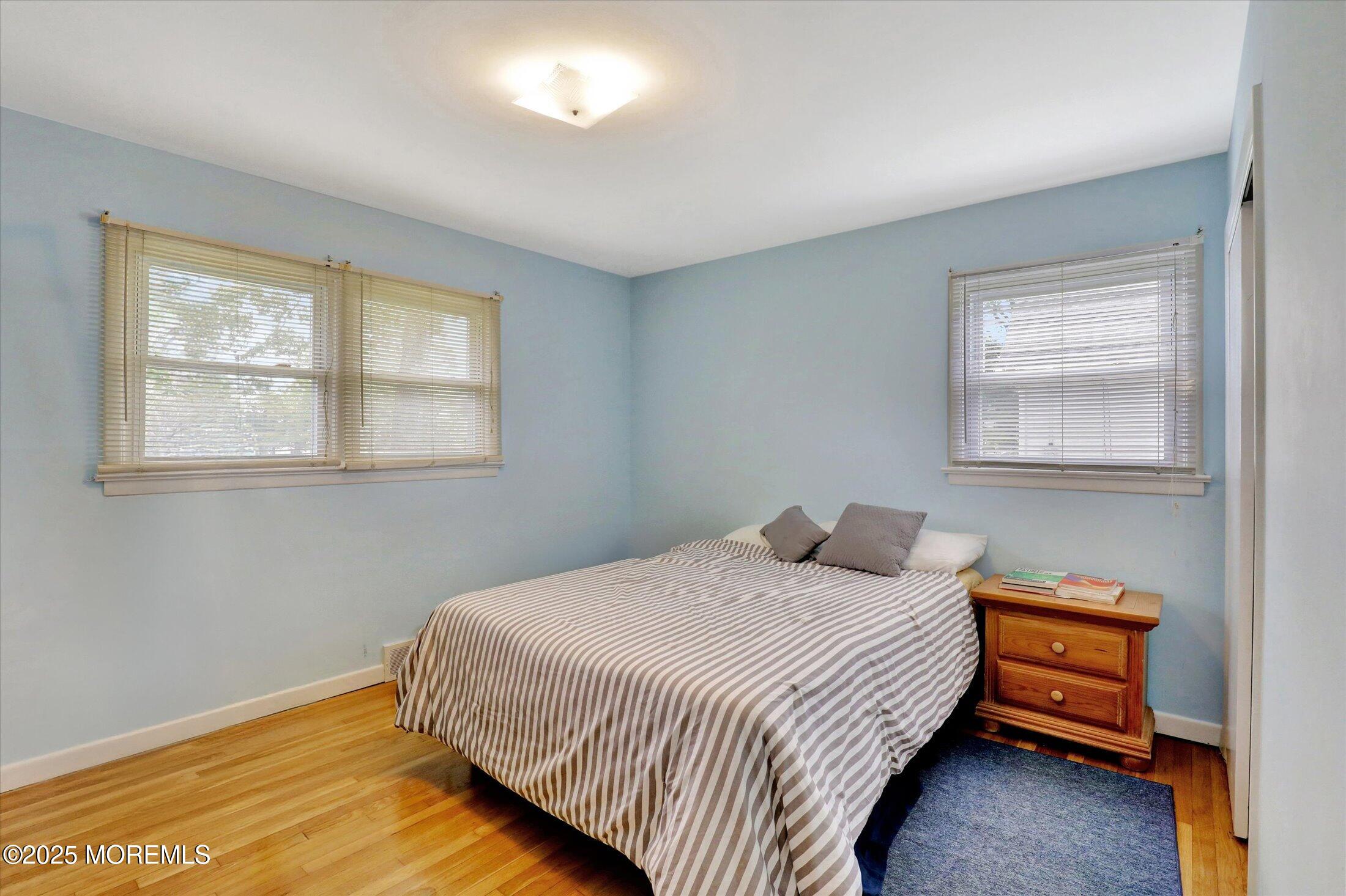 24 Berger Avenue Oakhurst, NJ 07755 - Photo 22 of 49 a bedroom with a bed and a window