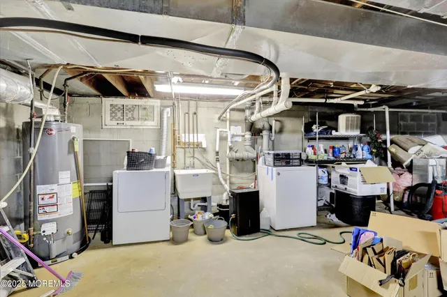 a room with stainless steel appliances kitchen island granite countertop furniture and a kitchen view