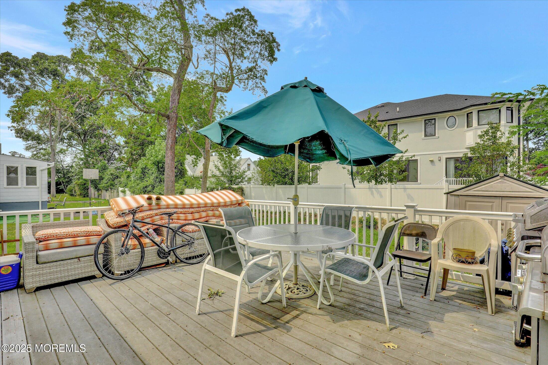 24 Berger Avenue Oakhurst, NJ 07755 - Photo 35 of 49 a view of a patio with furniture and table