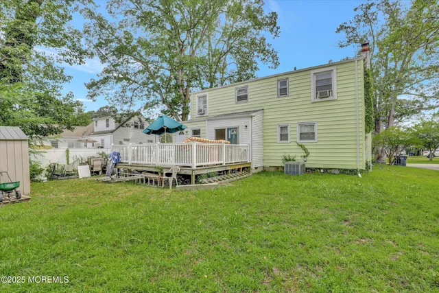 a view of a backyard with a house and garden