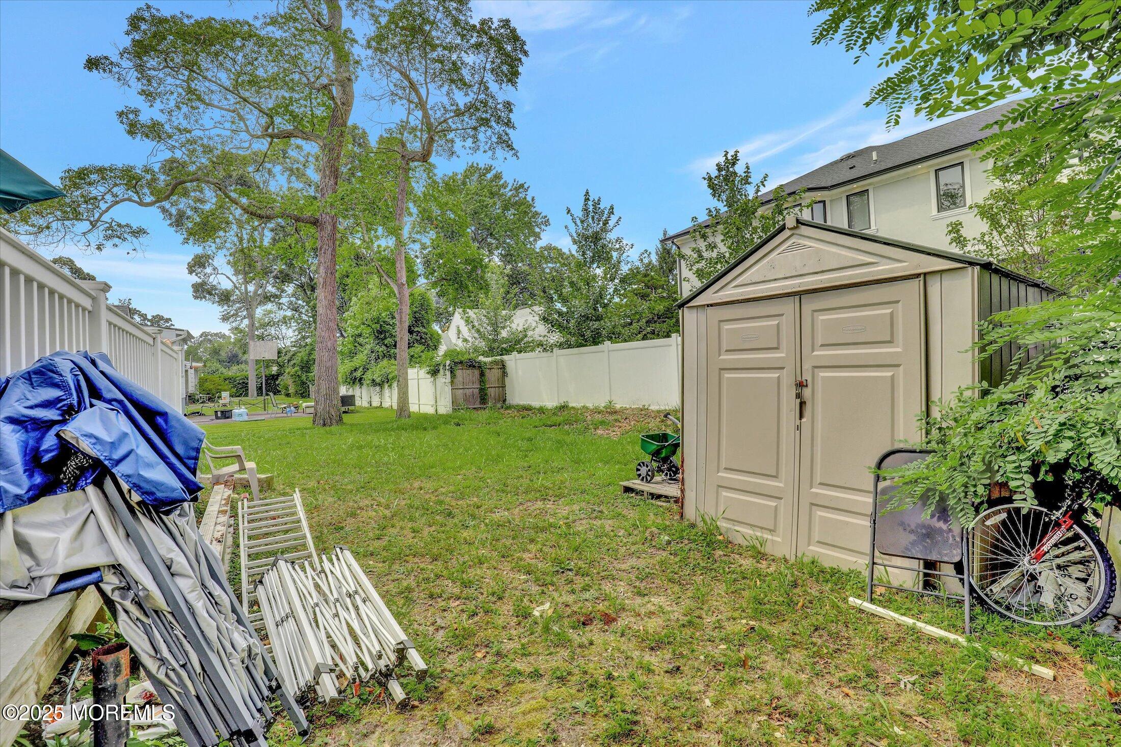 24 Berger Avenue Oakhurst, NJ 07755 - Photo 39 of 49 a view of a house with backyard and sitting area