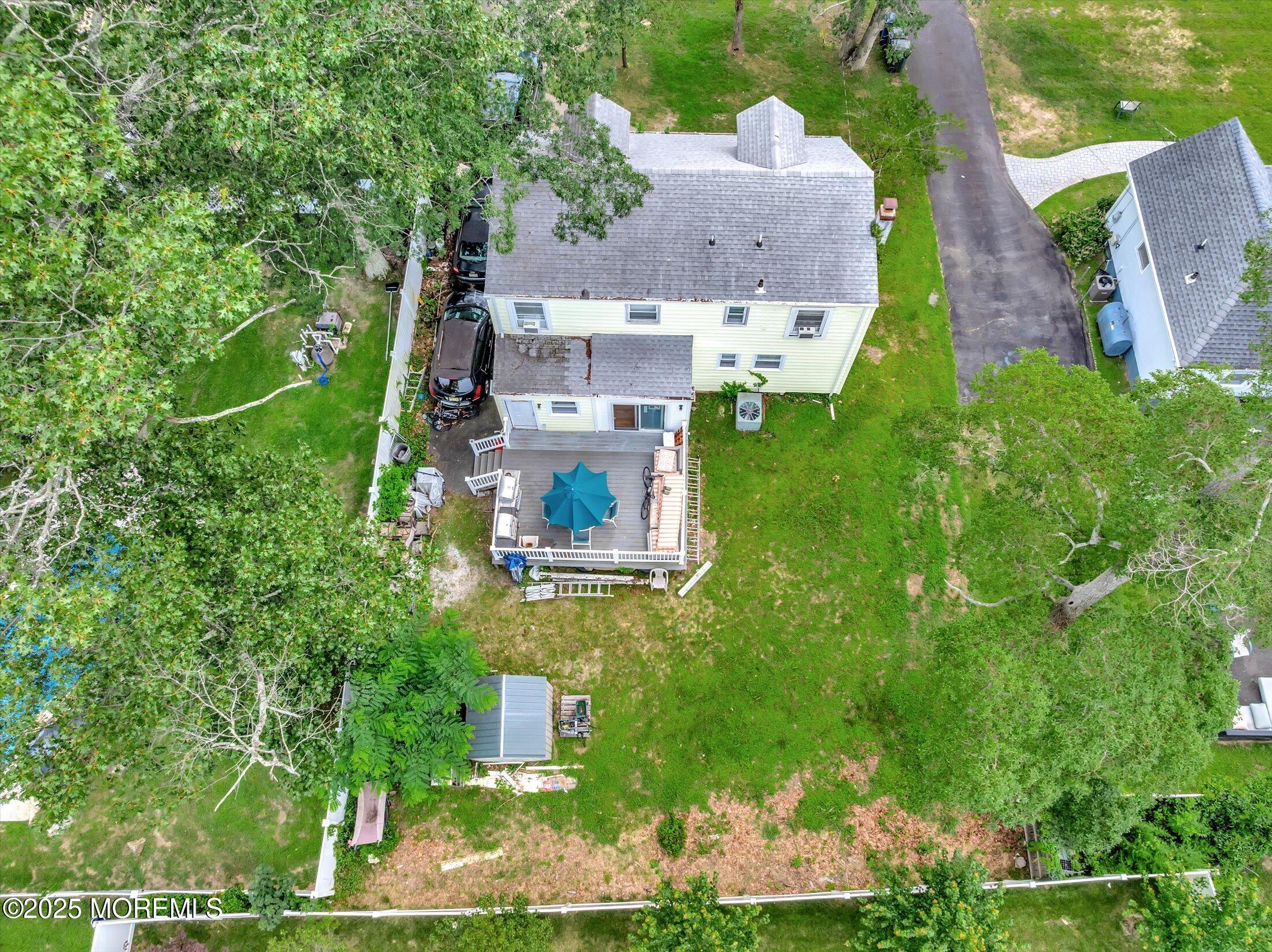 24 Berger Avenue Oakhurst, NJ 07755 - Photo 43 of 49 an aerial view of residential houses with outdoor space and trees all around
