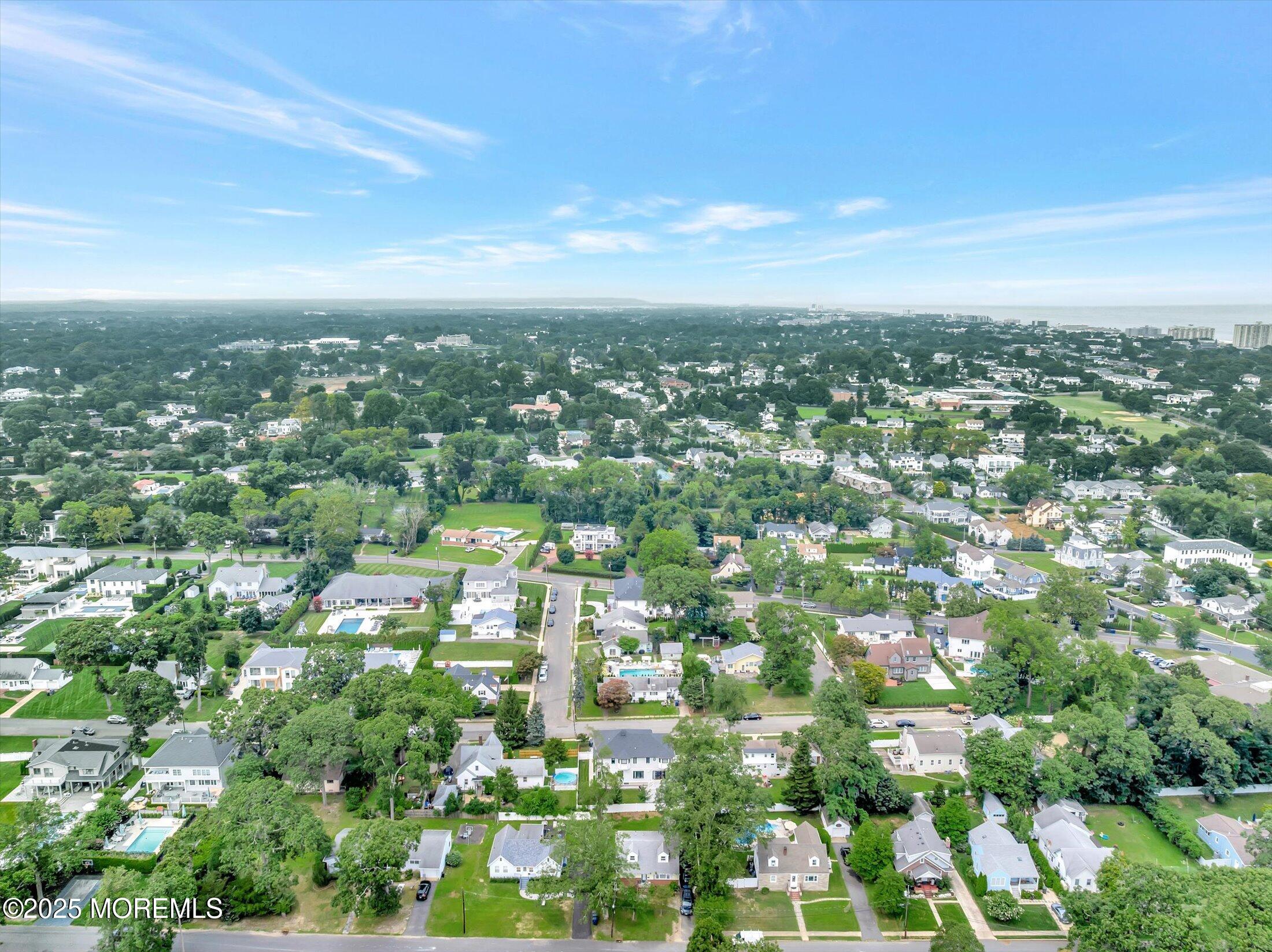 24 Berger Avenue Oakhurst, NJ 07755 - Photo 45 of 49 an aerial view of residential houses with city view