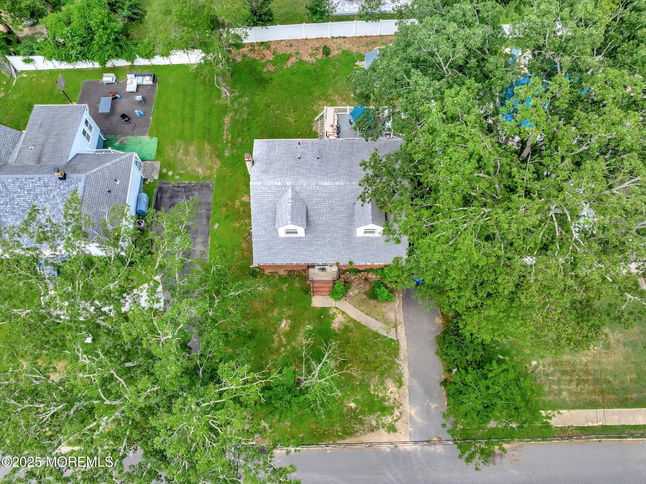 24 Berger Avenue Oakhurst, NJ 07755 - Photo 47 of 49 an aerial view of a house with a yard basket ball court and outdoor seating