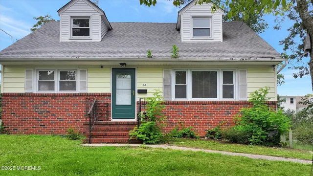 front view of a house with a yard