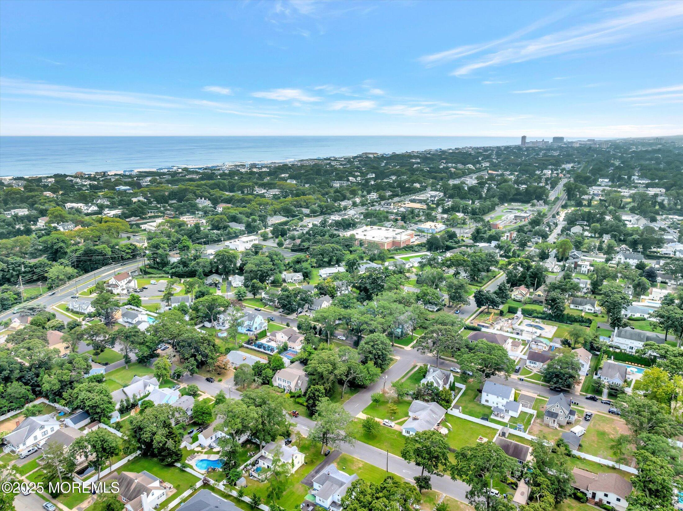 24 Berger Avenue Oakhurst, NJ 07755 - Photo 7 of 49 an aerial view of residential houses with outdoor space and trees