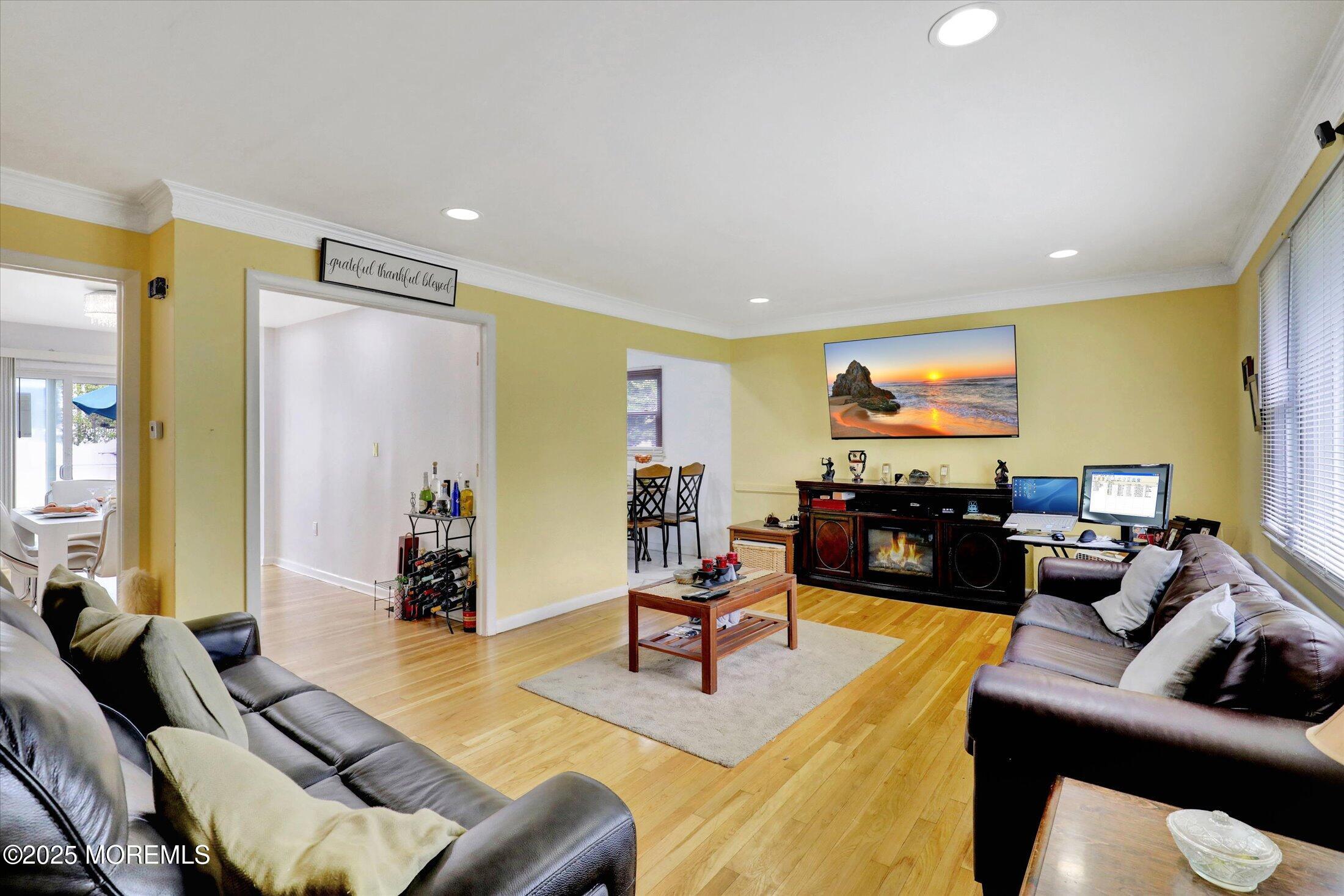 24 Berger Avenue Oakhurst, NJ 07755 - Photo 8 of 49 a living room with furniture and a flat screen tv
