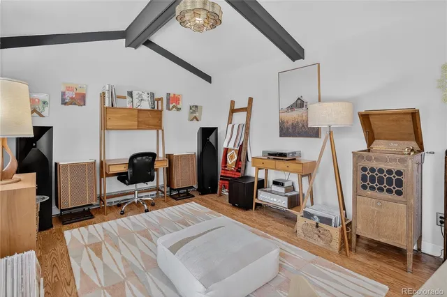 a bed room with a bed and a chair