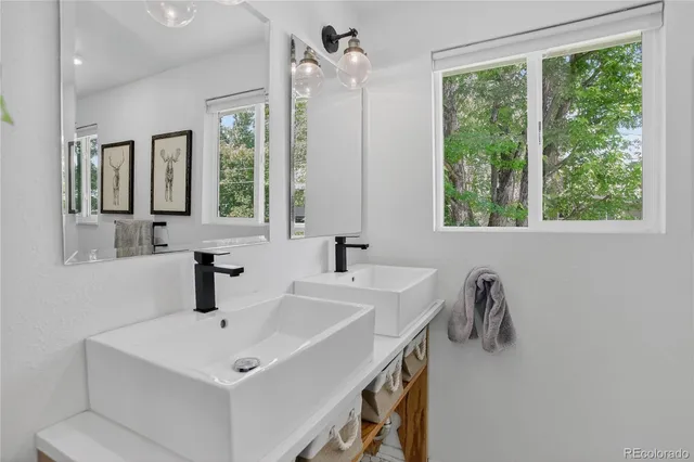 a bathroom with a sink and a window