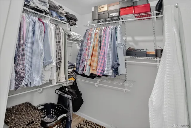 a room with lots of different colored cloths