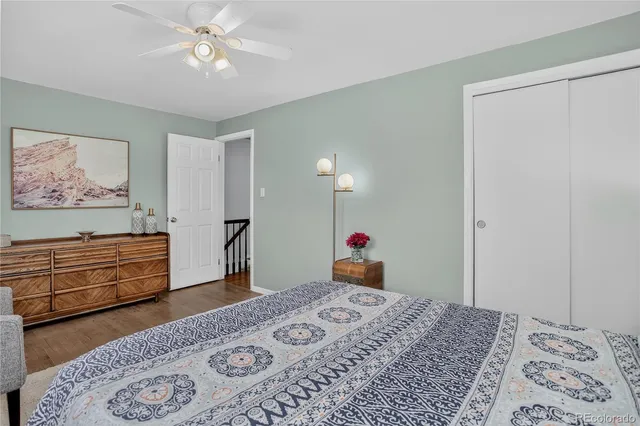 a bedroom with a bed dresser and a window