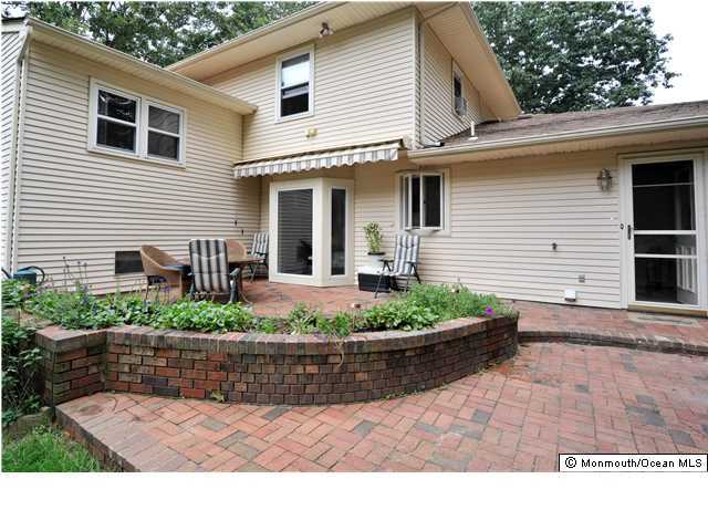 41 Eaglenest Road Freehold, NJ 07728 - Photo 2 of 16 a front view of a house with garage