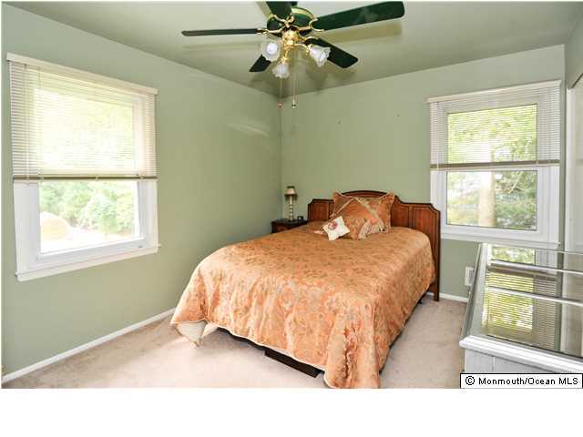 41 Eaglenest Road Freehold, NJ 07728 - Photo 14 of 16 a bedroom with a bed and a window