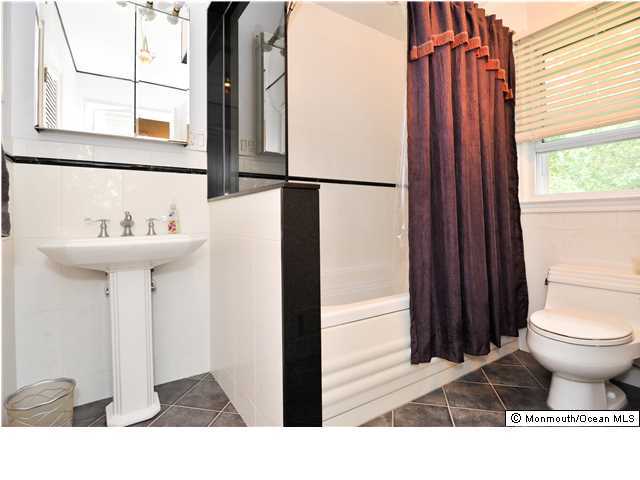 41 Eaglenest Road Freehold, NJ 07728 - Photo 15 of 16 a bathroom with a sink and a toilet