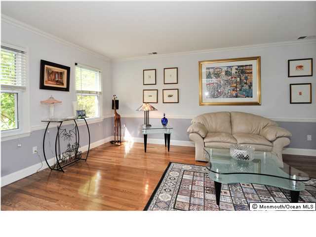 41 Eaglenest Road Freehold, NJ 07728 - Photo 8 of 16 a living room with furniture and a table