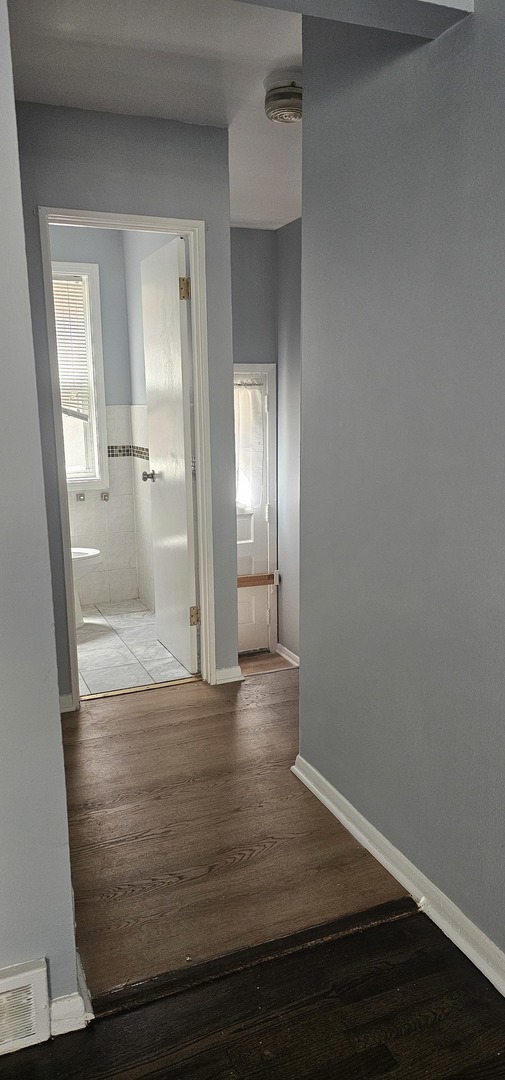 5115 North Springfield Avenue, Unit B Chicago, IL 60625 - Photo 11 of 11 wooden floor in an empty room