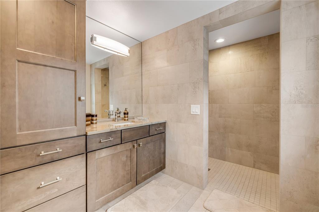 1 Mar Azul North Ponce Inlet, FL 32127 - Photo 16 of 76 a bathroom with a shower sink and mirror