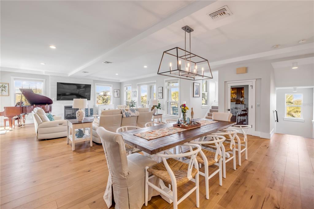 1 Mar Azul North Ponce Inlet, FL 32127 - Photo 18 of 76 a view of a dining room with furniture window and wooden floor