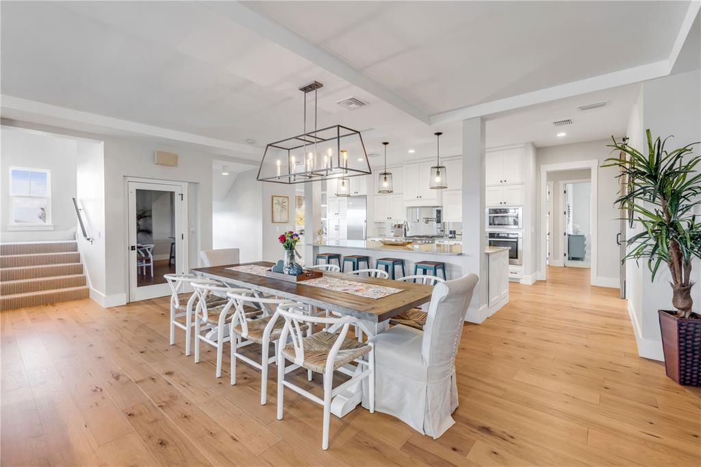 1 Mar Azul North Ponce Inlet, FL 32127 - Photo 19 of 76 a view of a dining room with furniture and wooden floor