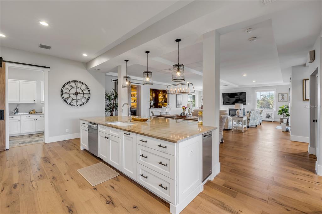 1 Mar Azul North Ponce Inlet, FL 32127 - Photo 24 of 76 a large kitchen with stainless steel appliances granite countertop a lot of counter space and wooden floor