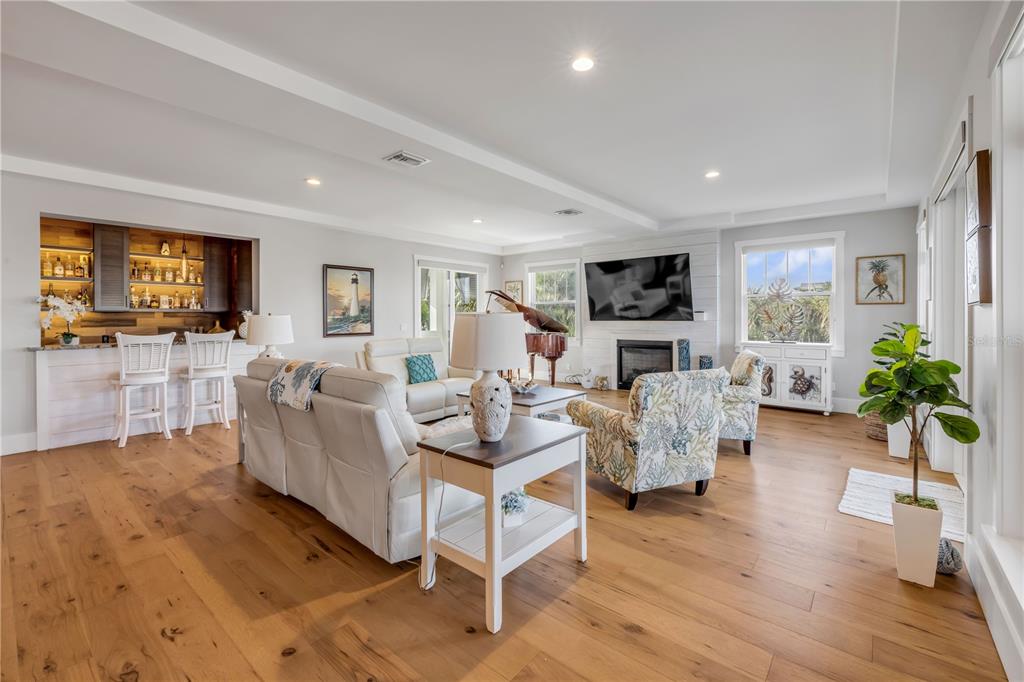 1 Mar Azul North Ponce Inlet, FL 32127 - Photo 30 of 76 a living room with fireplace furniture and a flat screen tv