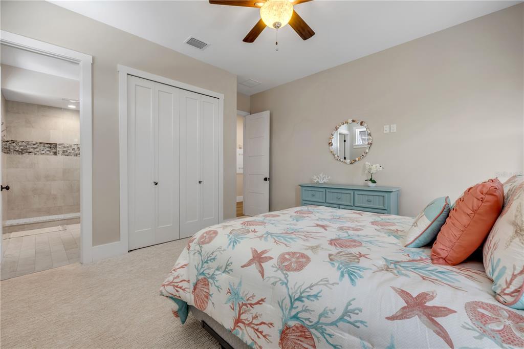 1 Mar Azul North Ponce Inlet, FL 32127 - Photo 39 of 76 a bedroom with a bed and a chandelier