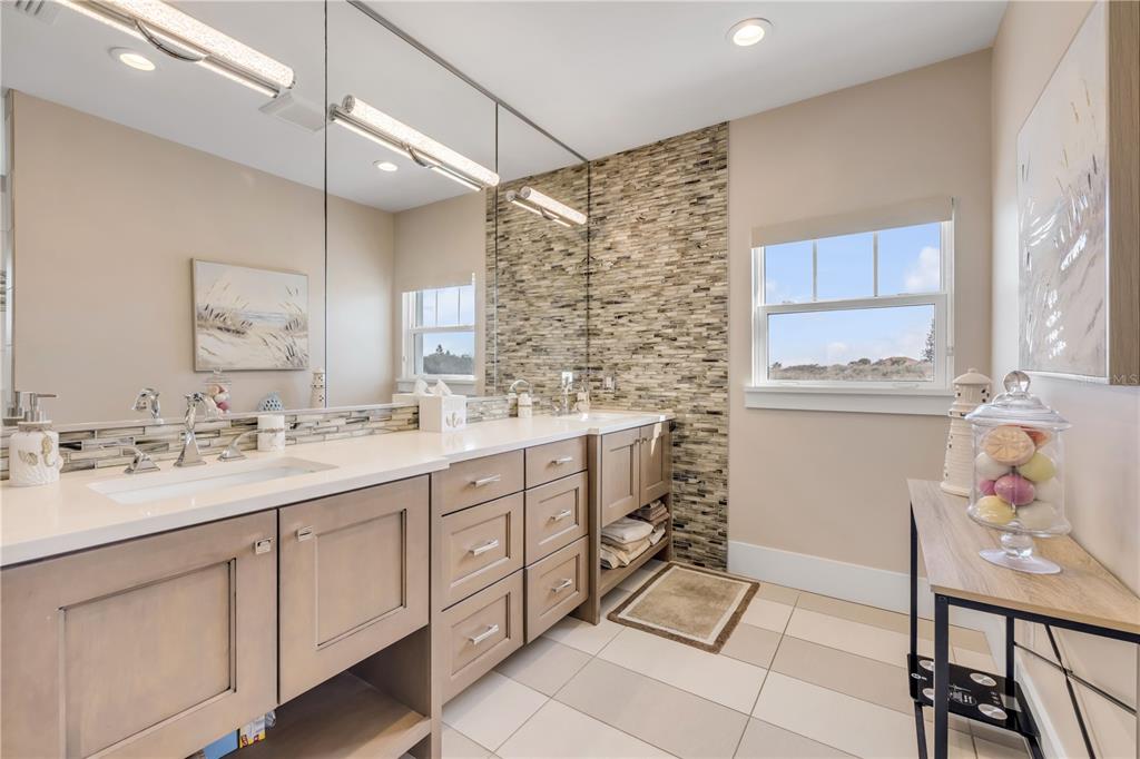 1 Mar Azul North Ponce Inlet, FL 32127 - Photo 49 of 76 a bathroom with a sink a vanity and a mirror